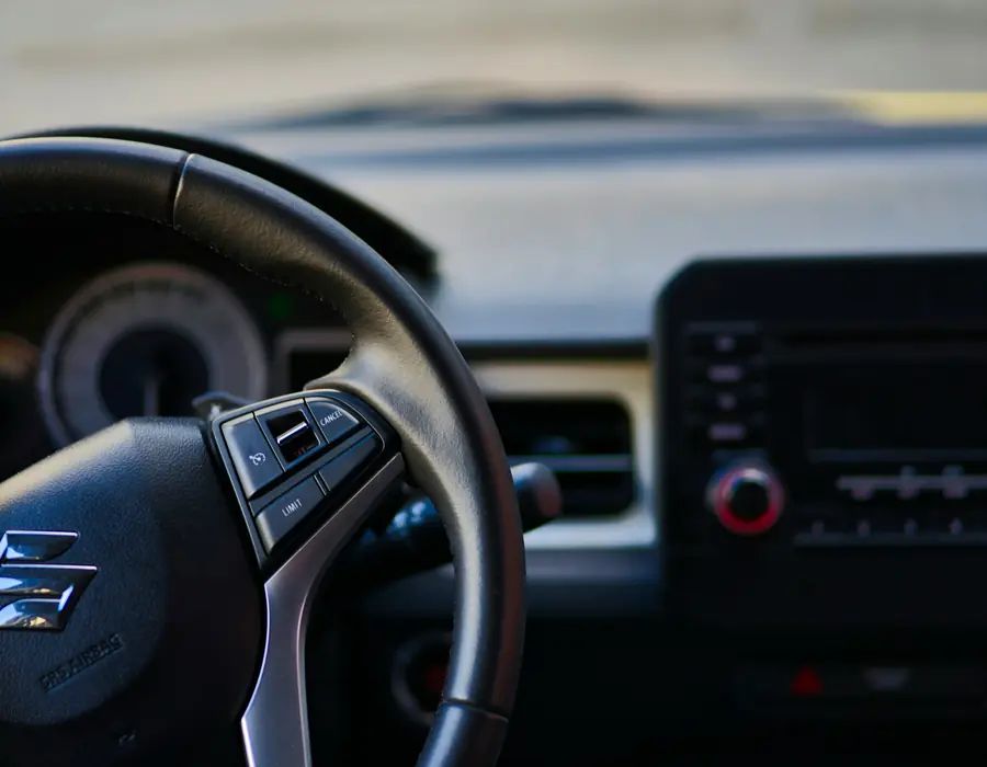 Suzuki cabin with cruise and speed-limit controls on the wheel